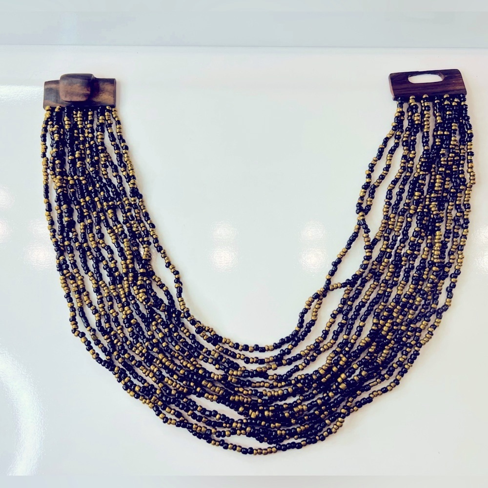 Beaded black and golden multilayered necklace / bib